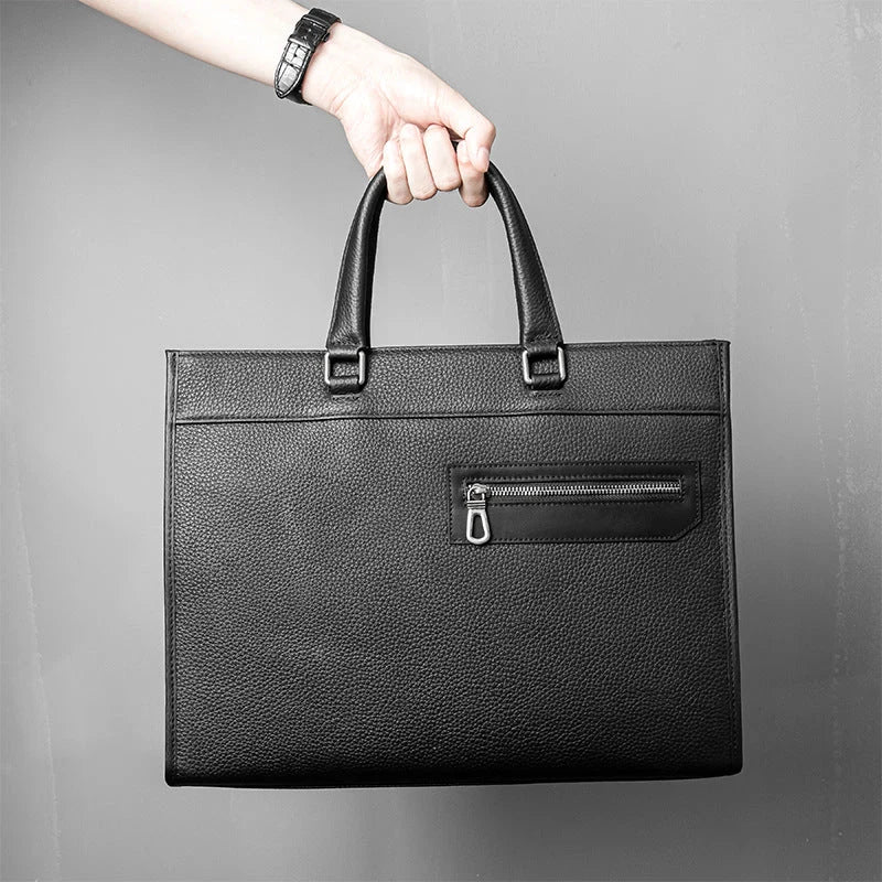 Sac en cuir noir pleine fleur vu de face avec poignée