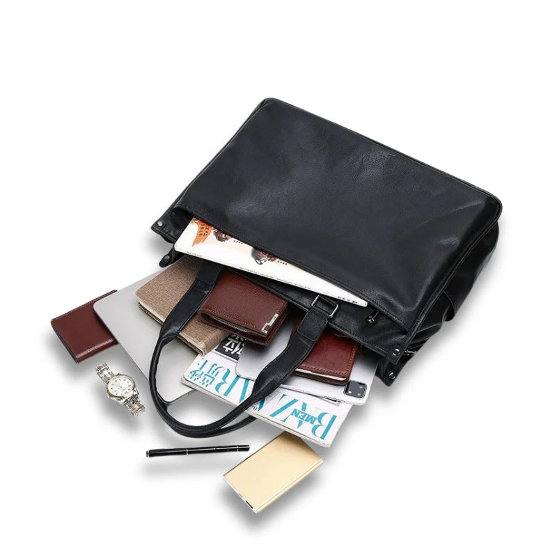 Mallette ouverte avec documents, ordinateur et accessoires visibles